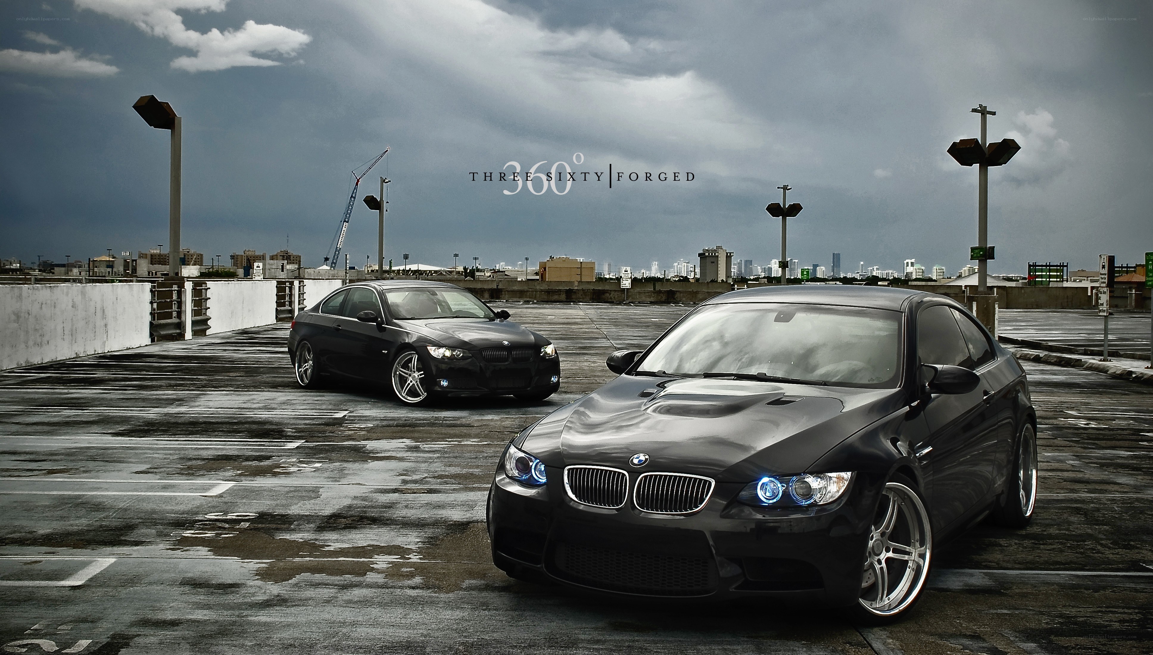 Two black BMWs on a rooftop