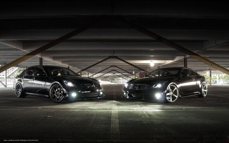 Two black Infiniti cars in garage