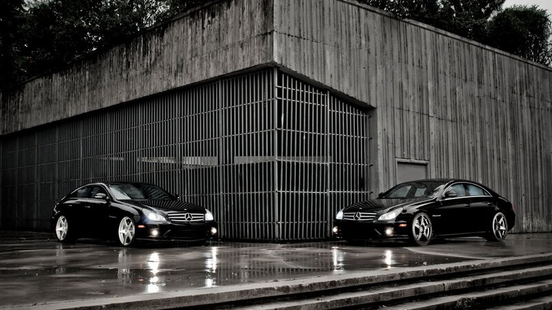 Two black Mercedes-Benz cars