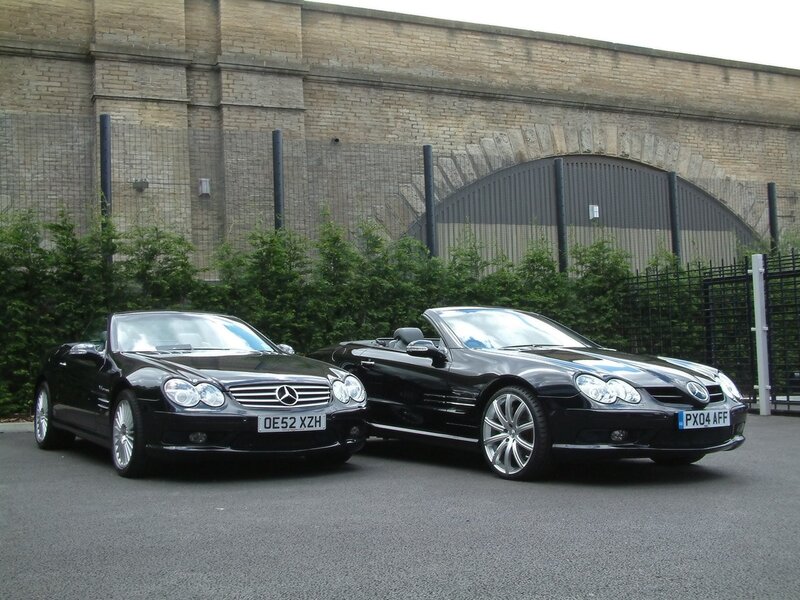 Two black Mercedes-Benz SLKs