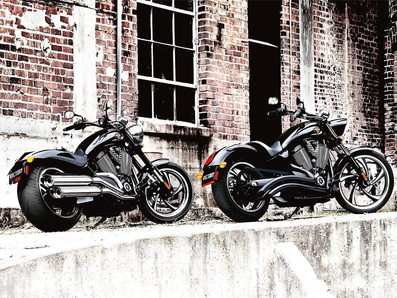 Two black motorcycles parked