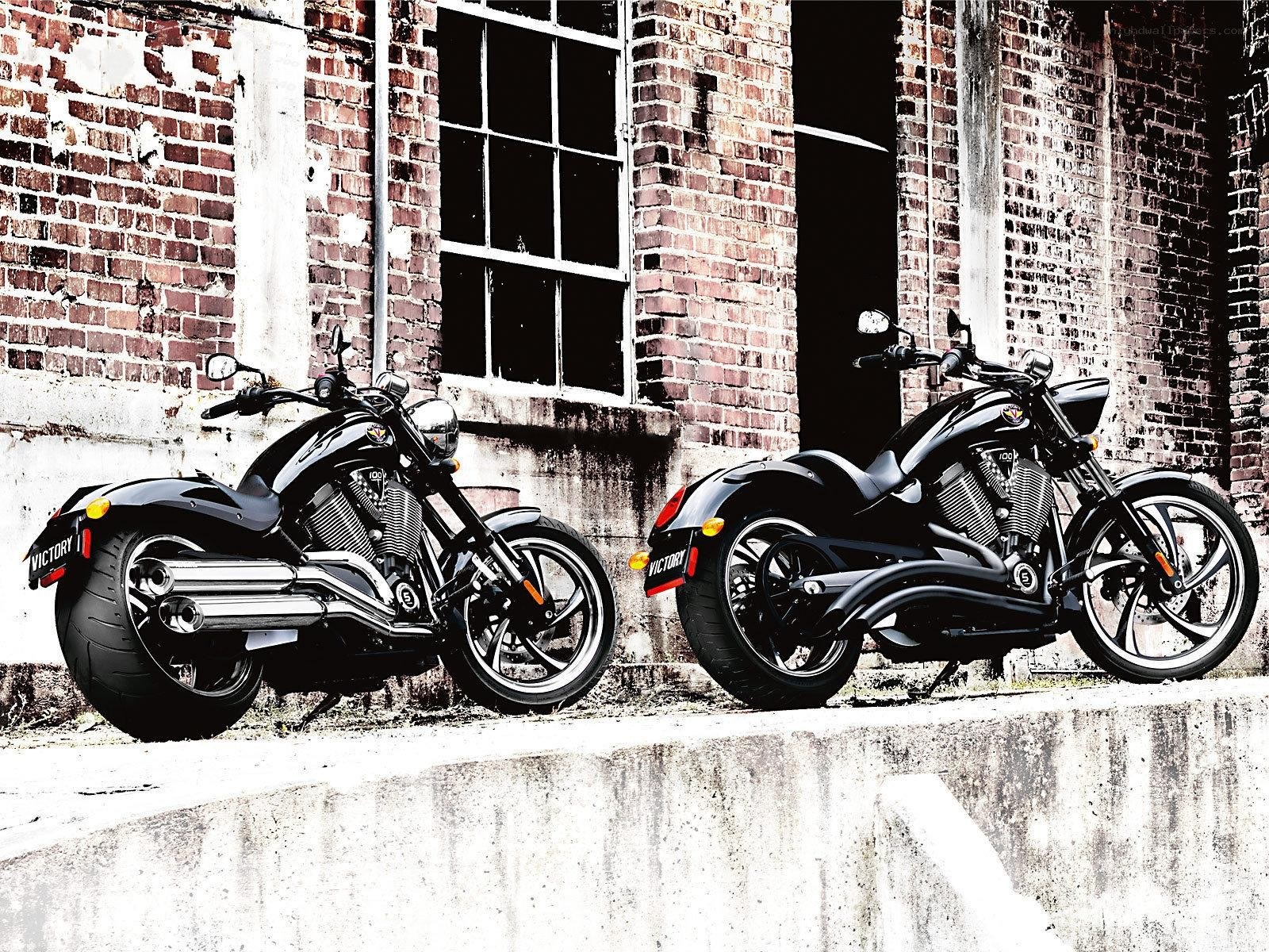 Two black motorcycles parked