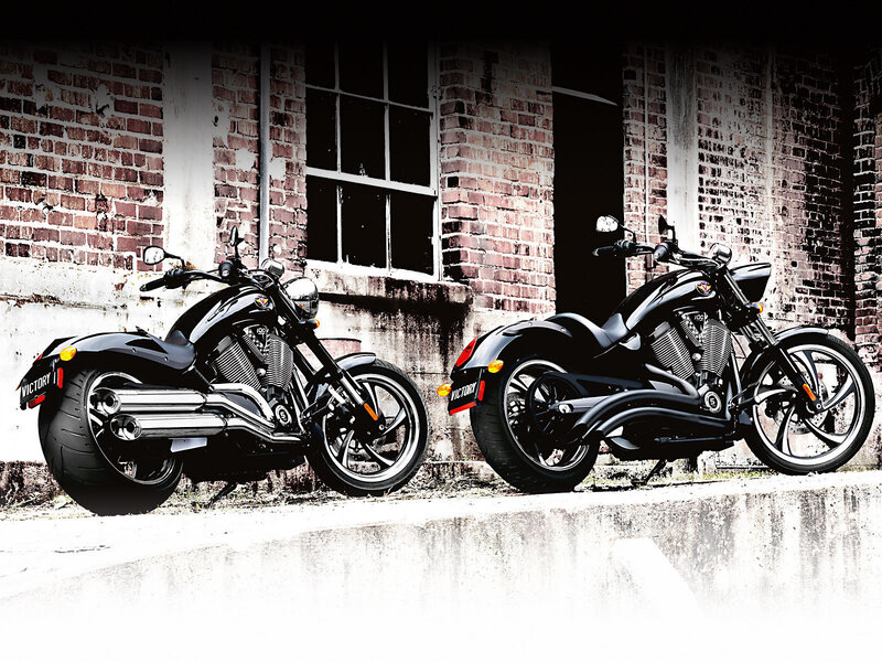 Two black motorcycles parked