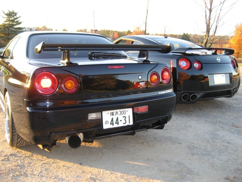 Two black Nissan GT-Rs parked