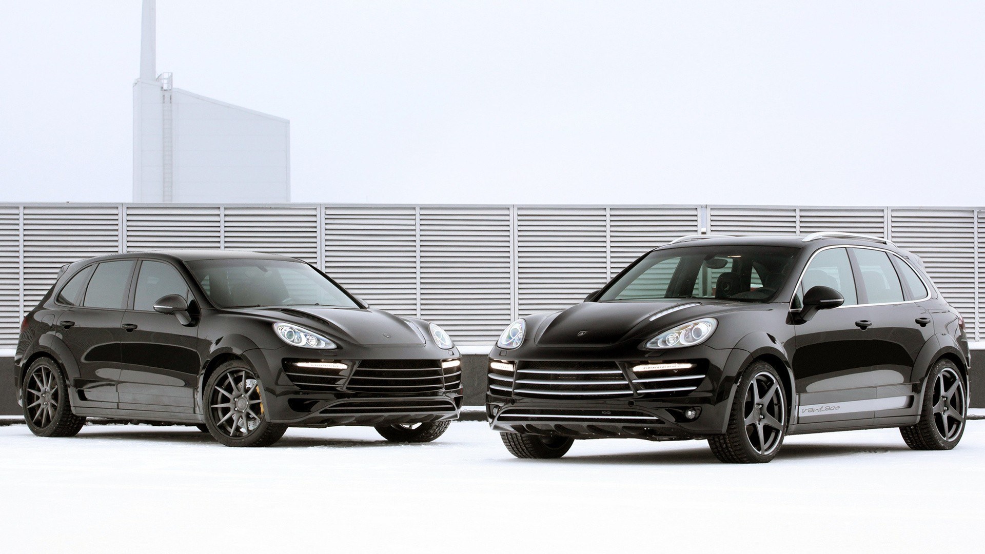Two black Porsche Cayenne cars