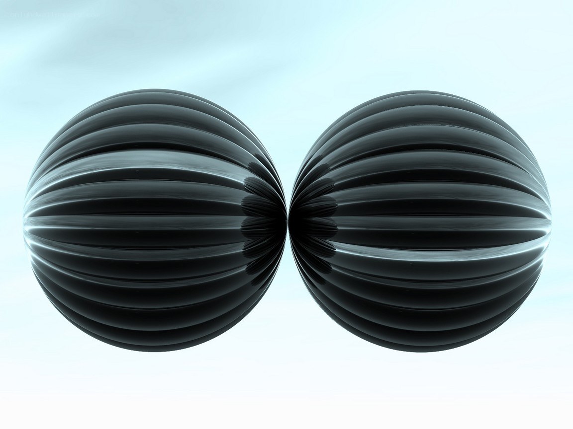 two black ribbed spheres