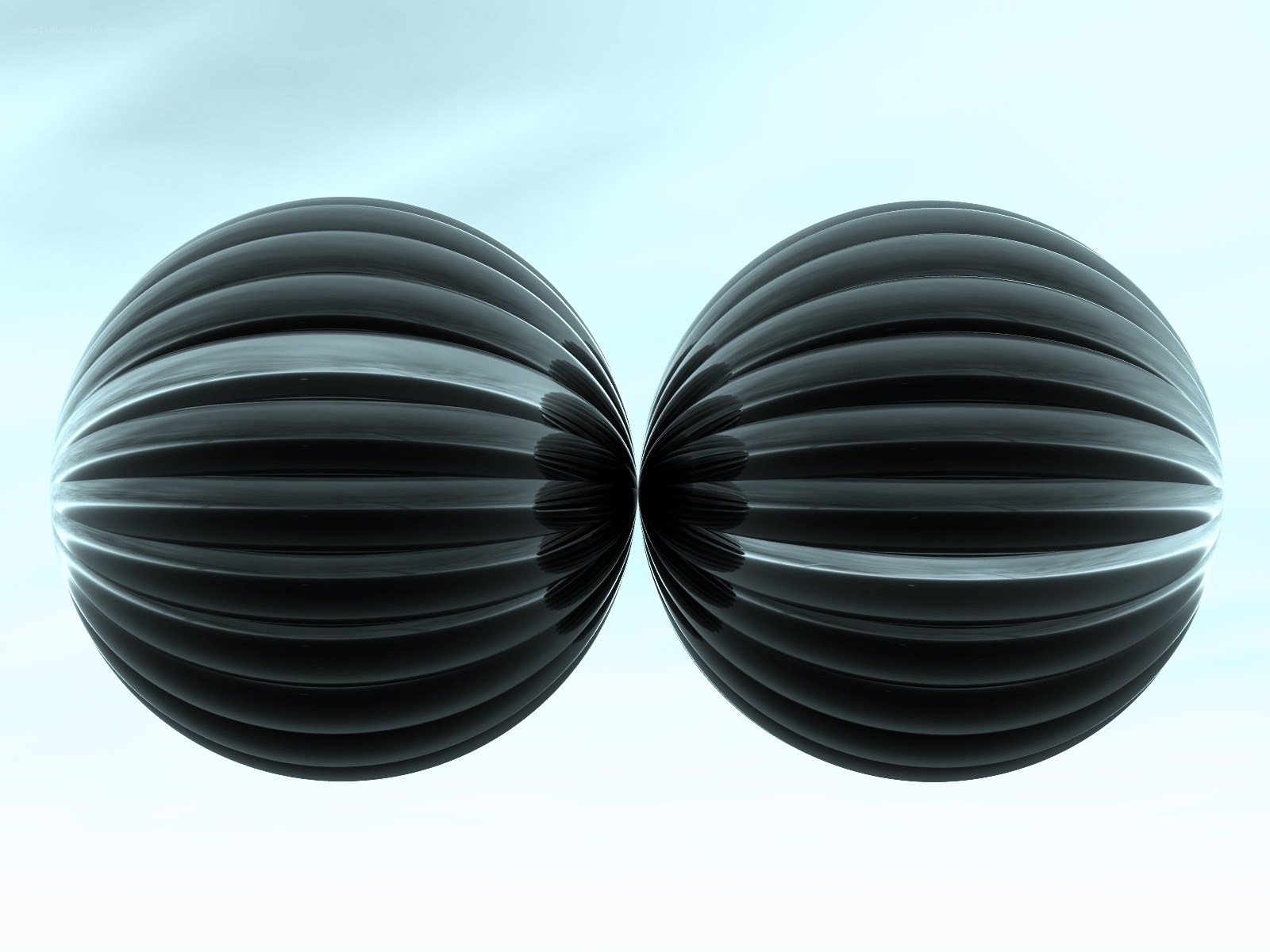 Two black ribbed spheres