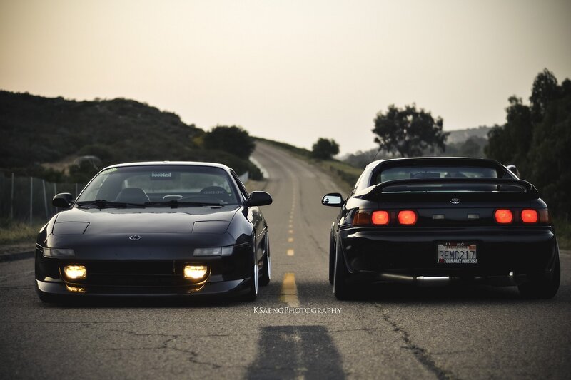 Two Black Sports Cars — Dramatic, Sunset, Photograph, Road