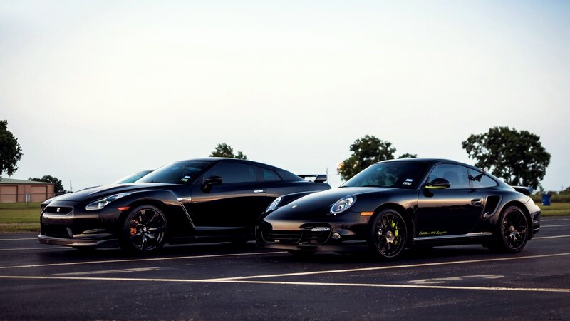 two black sports cars side by side
