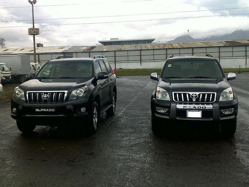 Two Black Toyota Prado SUVs
