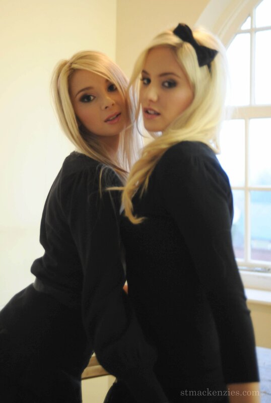 two blonde women in black