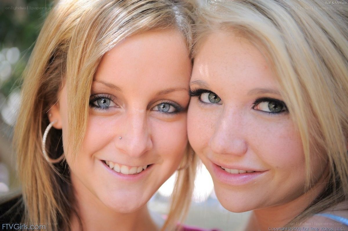 two blonde women smiling