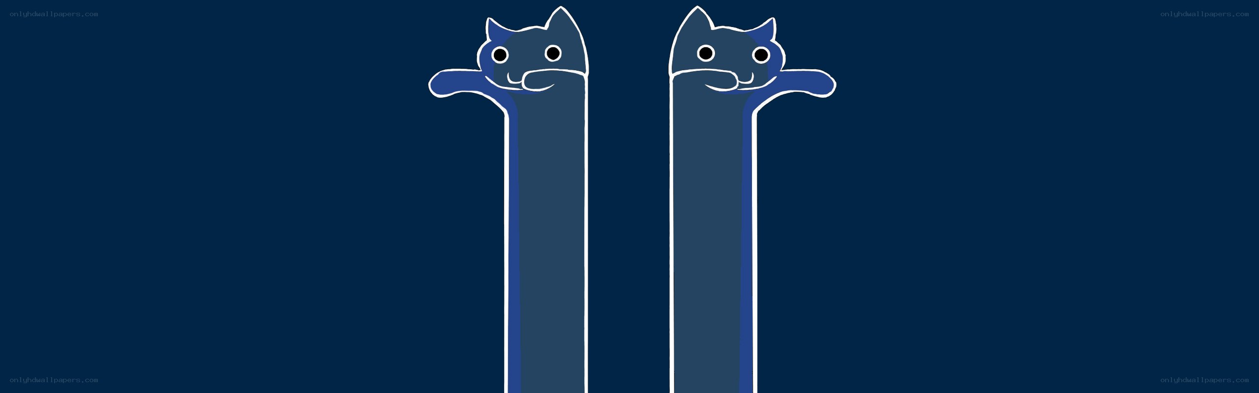 two blue cats on poles