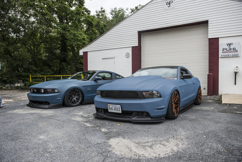 Two Blue Mustang Cars