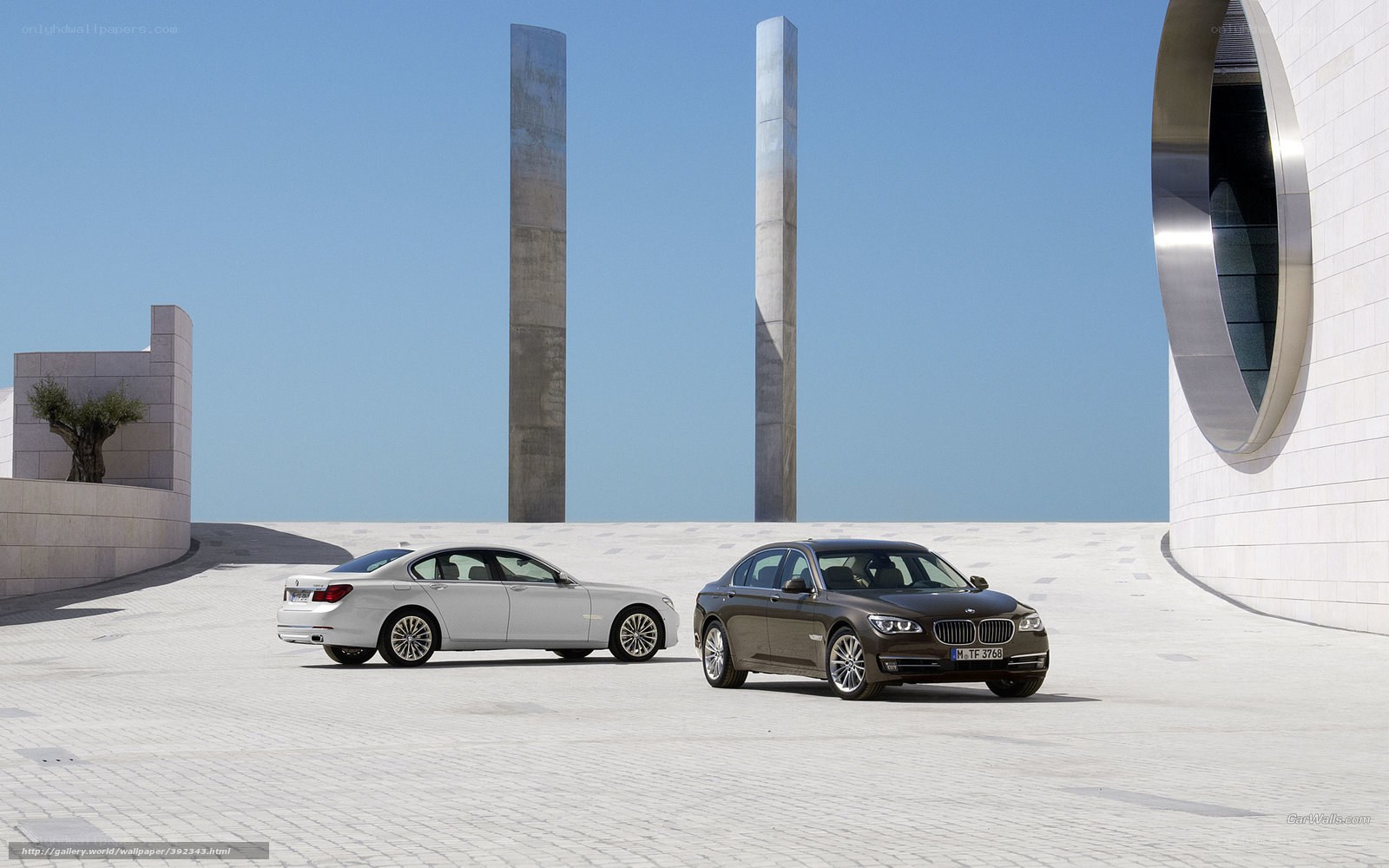 Two BMW 7 Series cars