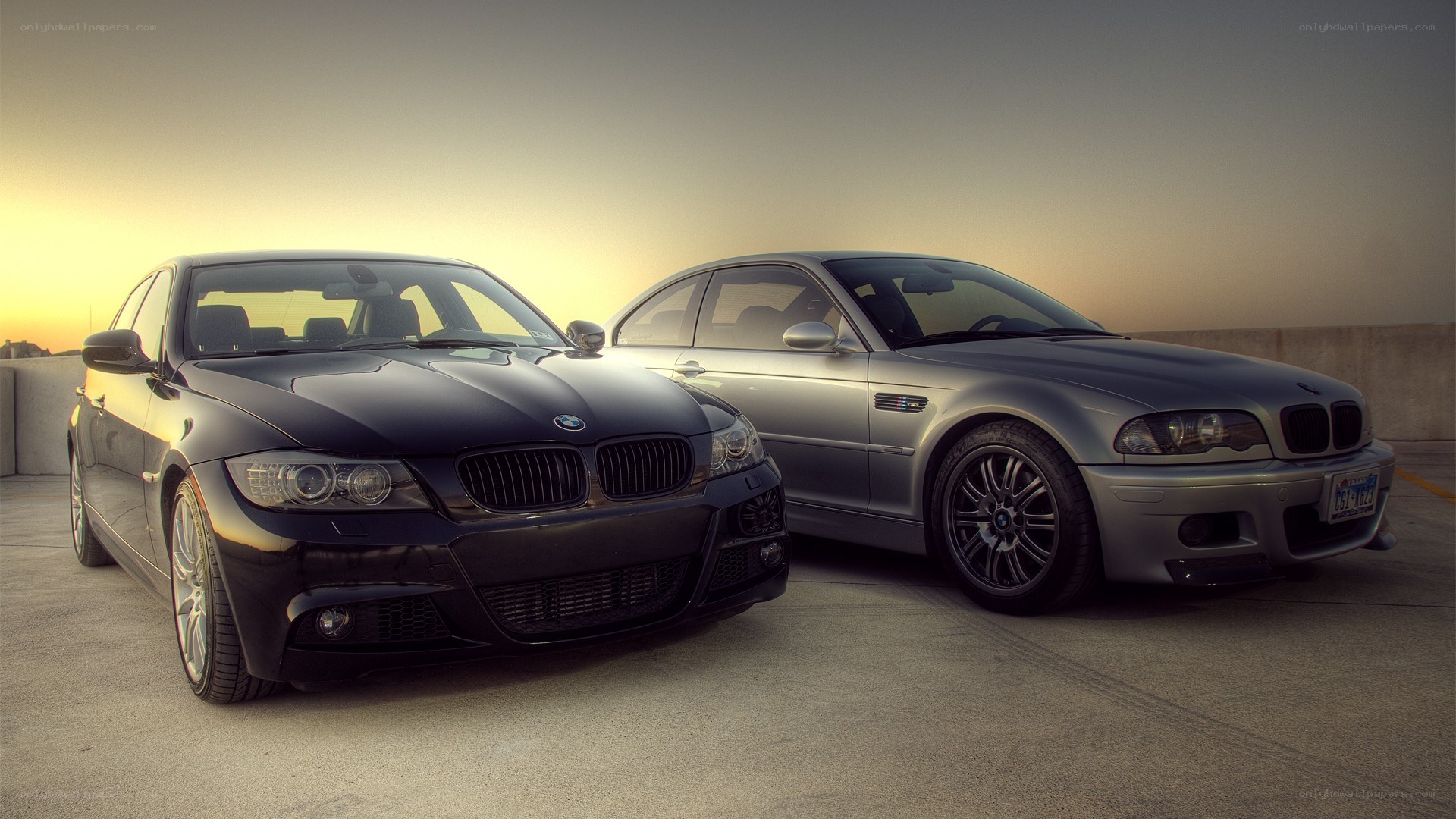 Two BMW cars at sunset