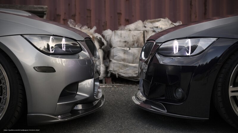 Two BMW cars facing each other