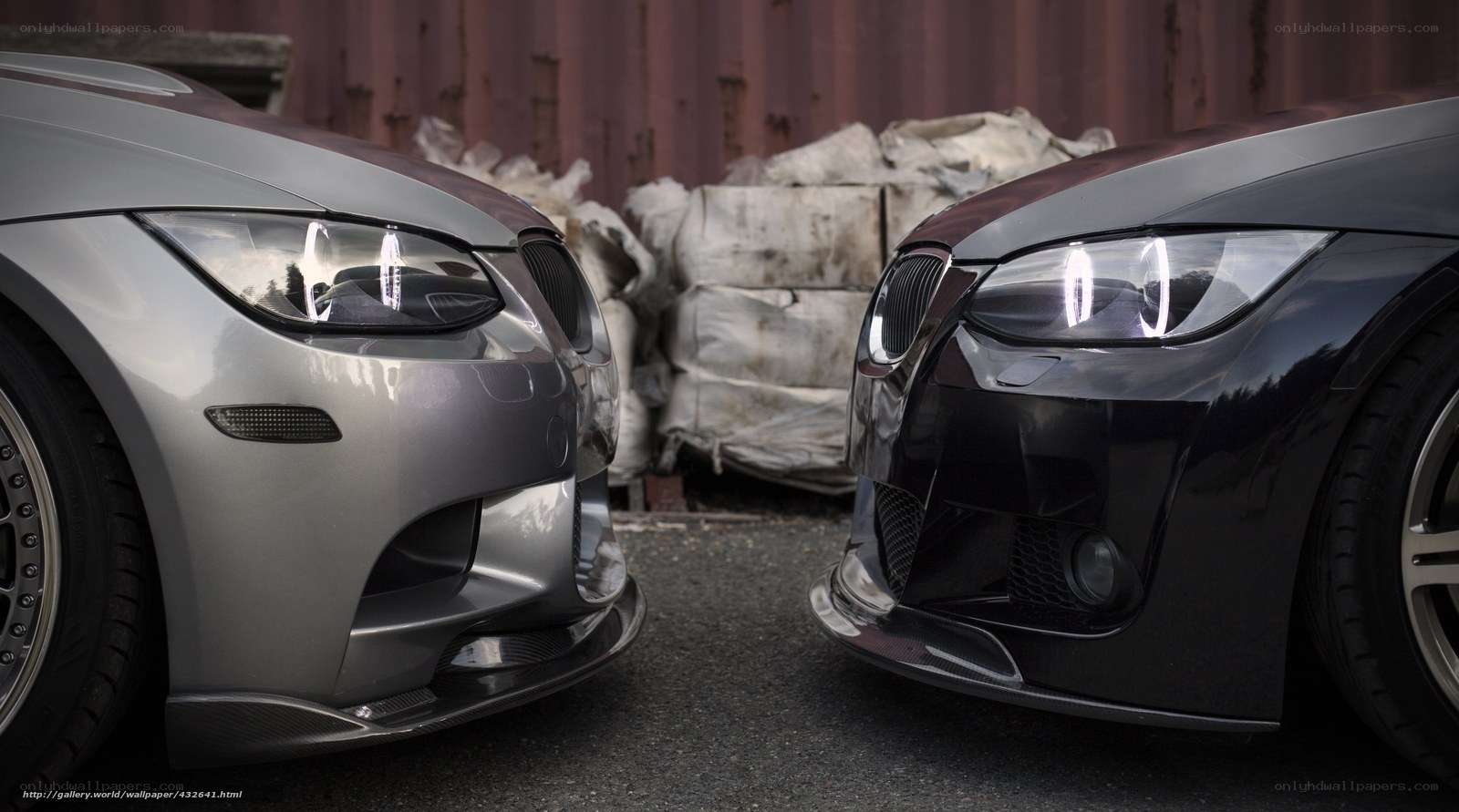 Two BMW cars facing each other