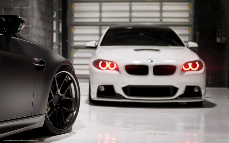 Two BMW cars in a garage