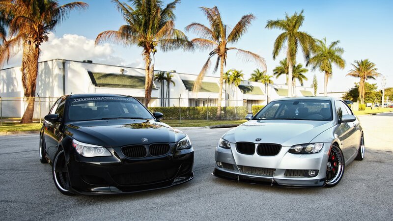 Two BMW cars in a parking lot
