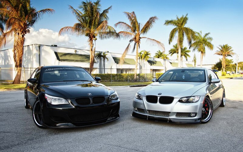 Two BMW cars in a parking lot