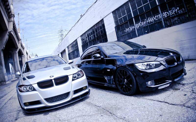 Two BMW cars in an urban setting
