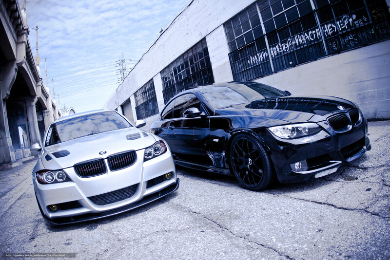 Two BMW cars in an urban setting
