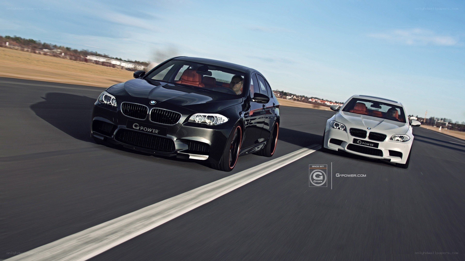 Two BMW cars on a racetrack