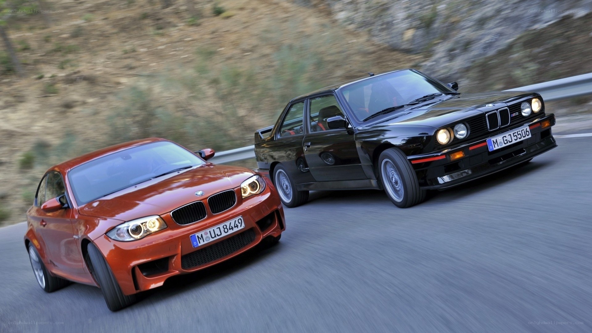 Two BMW cars on a road