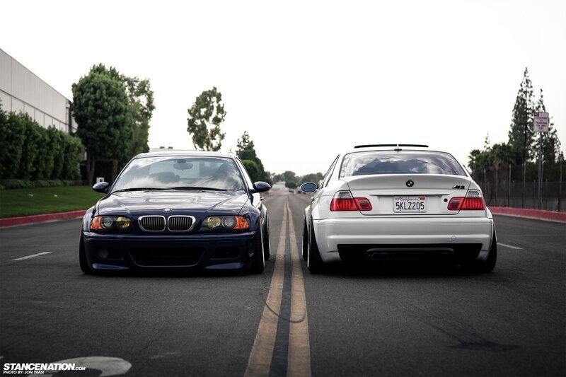 Two BMW Cars on Road — Black, Dramatic