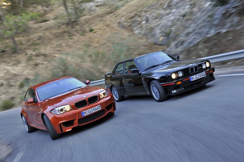 Two BMW Cars on Road — Red