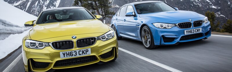 Two BMW Cars on Road — Yellow