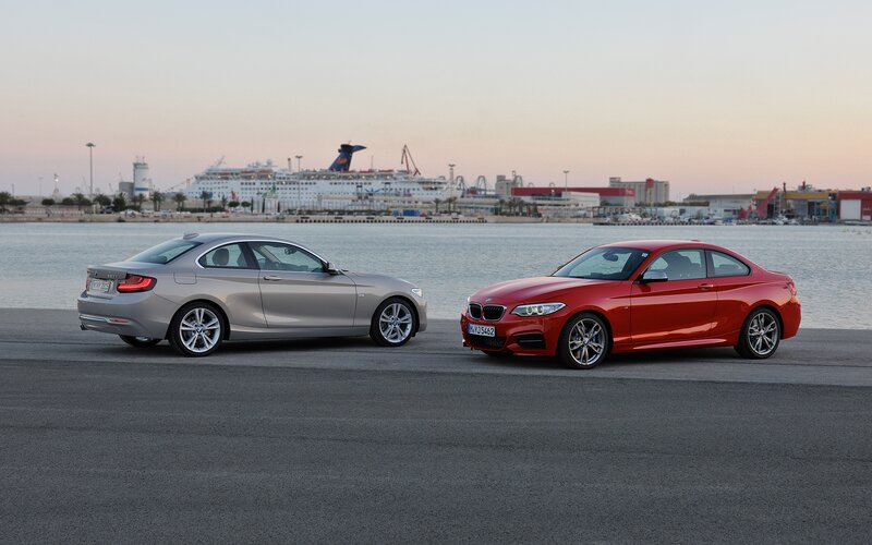 Two BMW Cars — Red, Serene