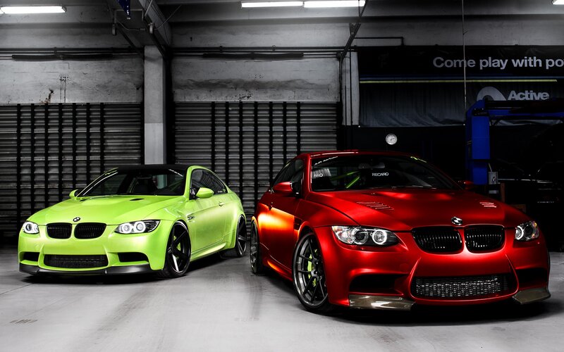 Two BMW M3 cars in a garage