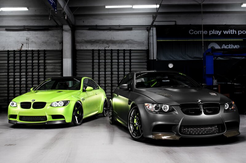 Two BMW M3 cars in garage