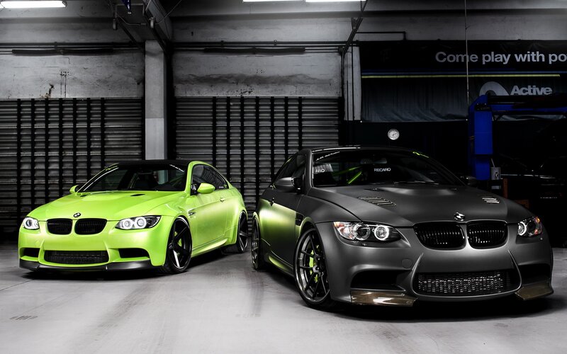 Two BMW M3 cars in garage