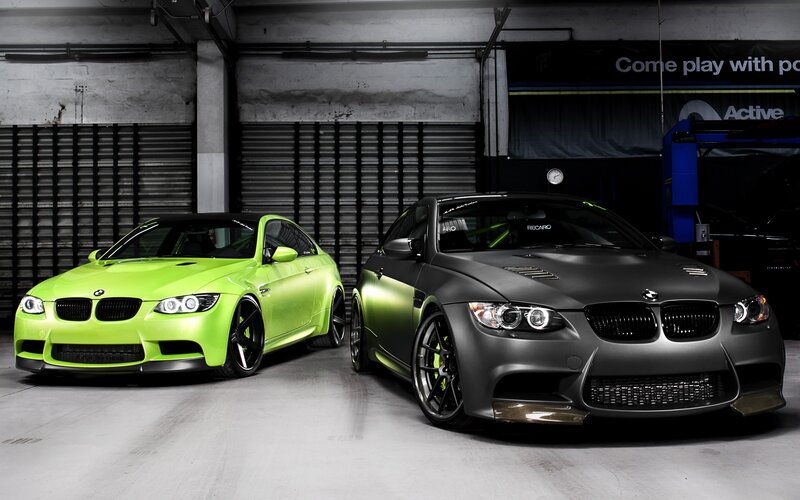 Two BMW M3 cars in garage