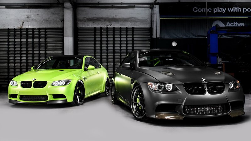 Two BMW M3 cars in garage