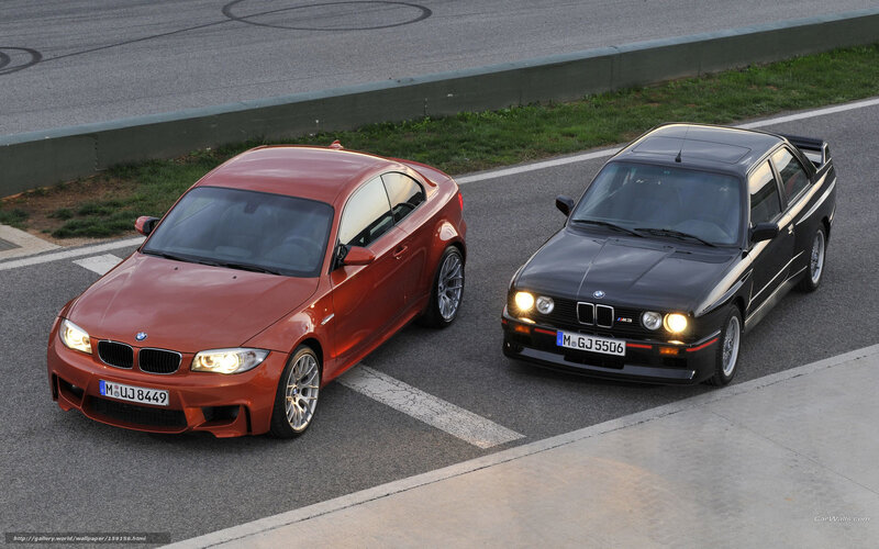 Two BMW M3 cars on a track