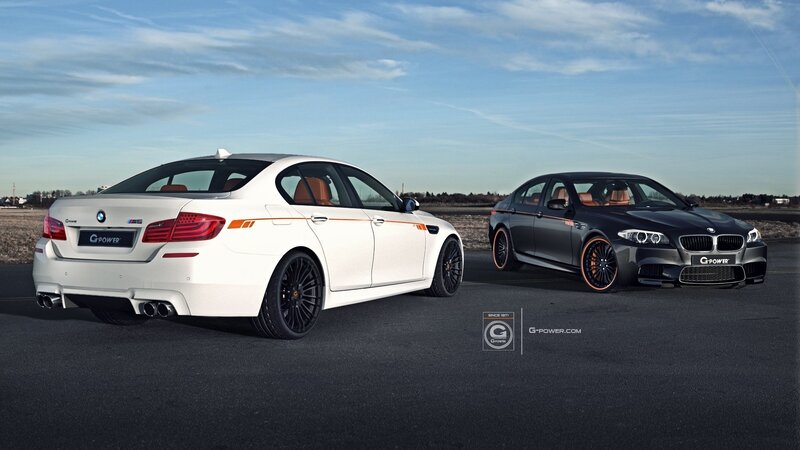Two BMW M5 cars on a track