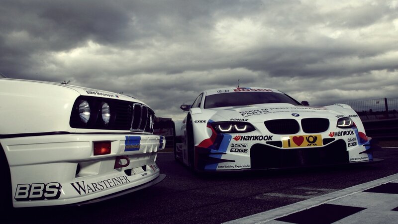 Two BMW race cars on track