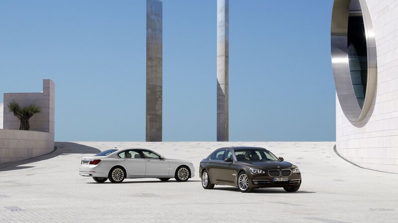 Two BMW Sedans — White