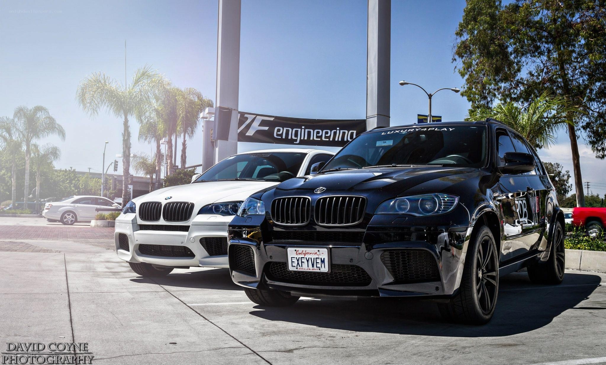 Two BMW SUVs at a dealership