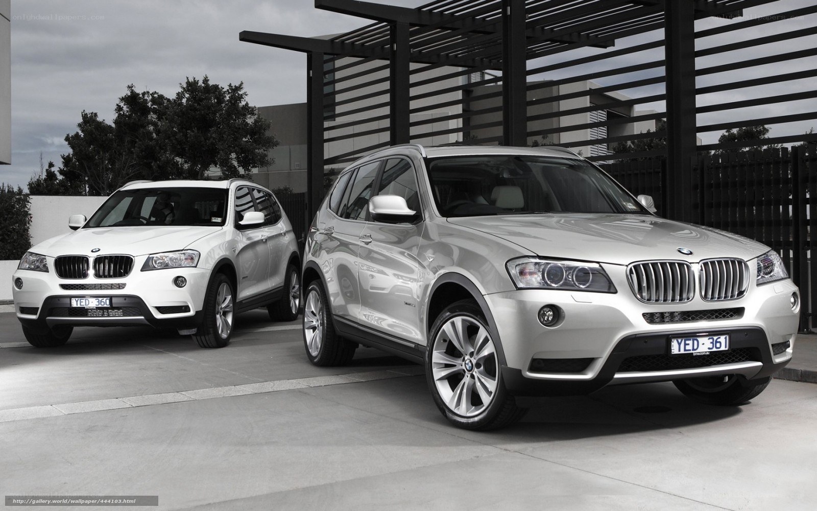 Two BMW X3 SUVs parked