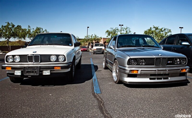 Two BMWs in a parking lot