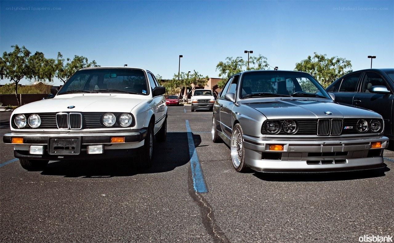Two BMWs in a parking lot