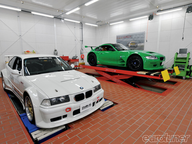 Two BMWs in a tuning workshop