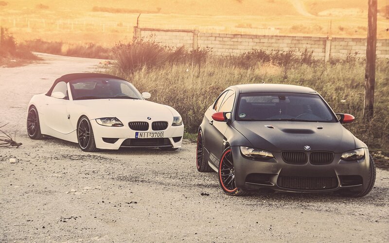 Two BMWs on a rural road