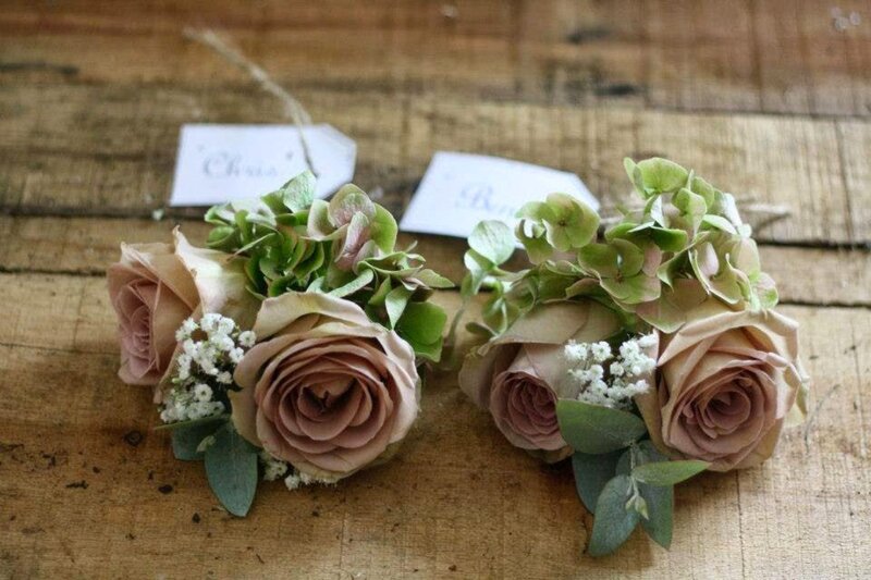 Two Boutonnieres on Wood