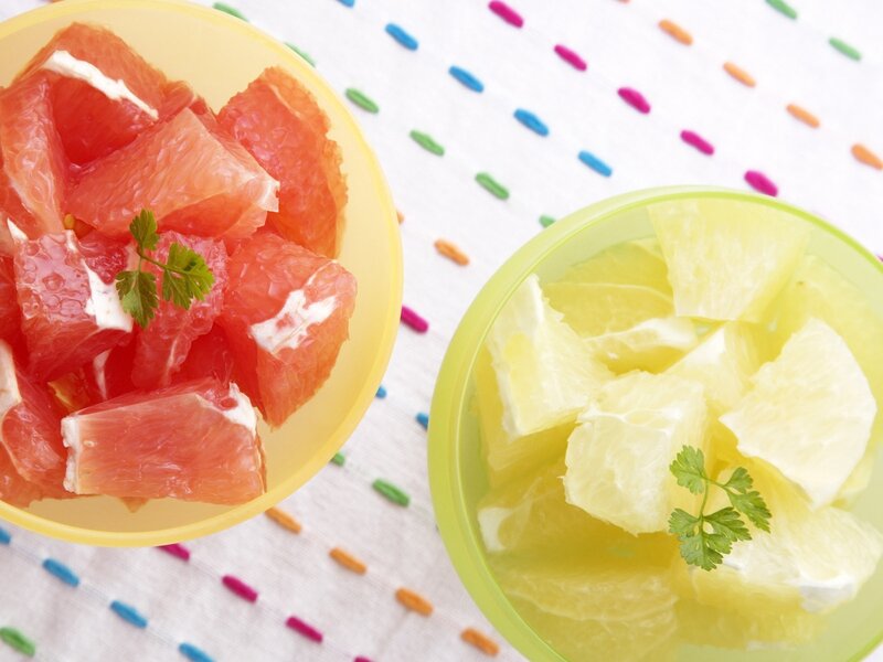 Two bowls of citrus fruit